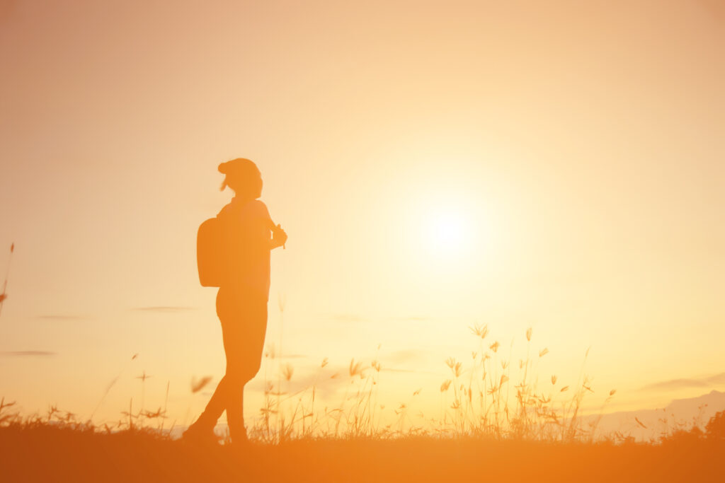 silhouette of woman praying over beautiful sky bac 2026 01 11 09 08 35 utc